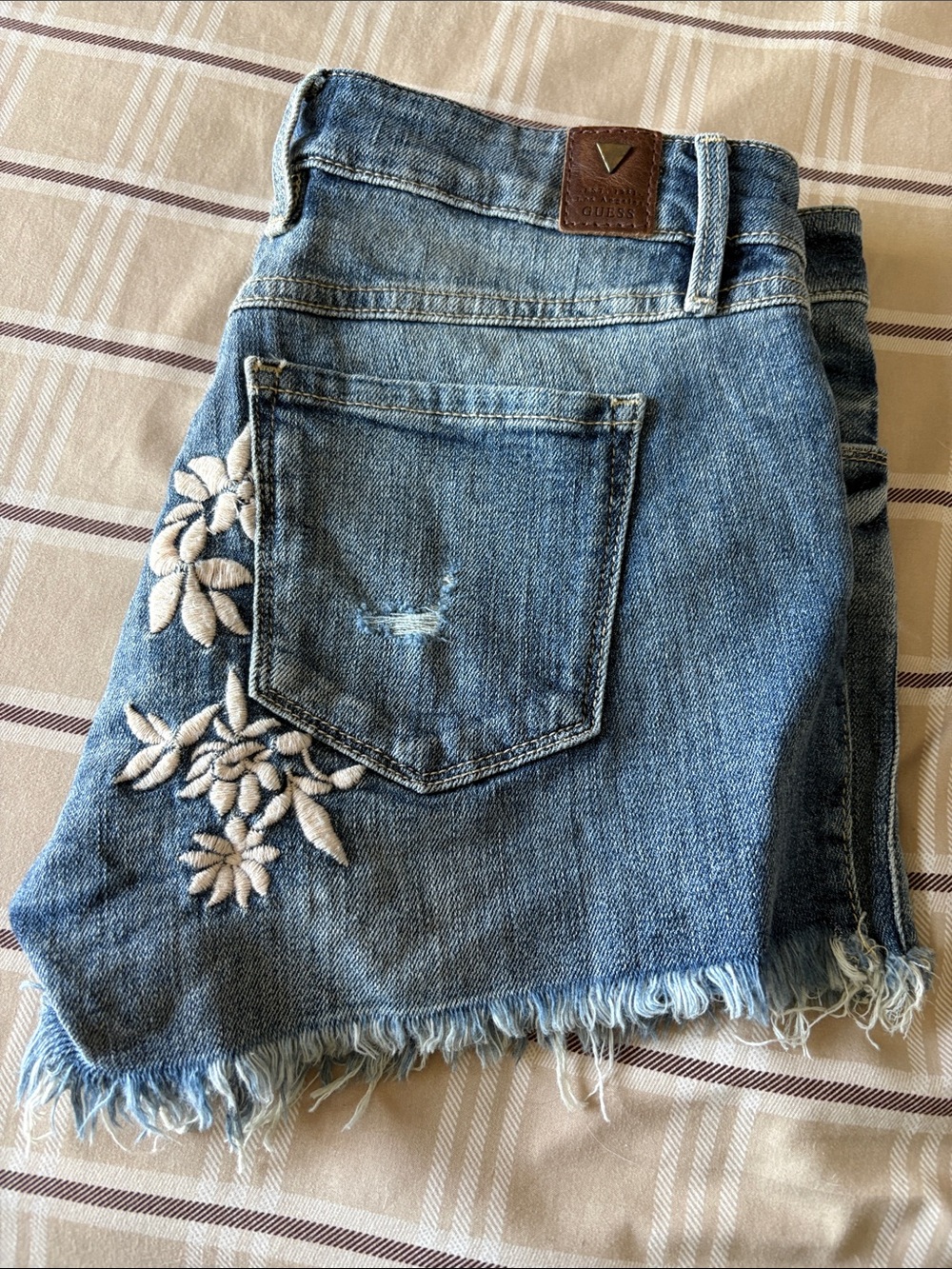Guess vintage blue denim cut-off shorts white floral embroidery and a frayed hem